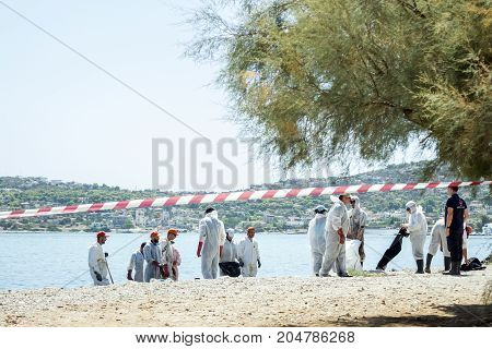 Greece. The Island Of Salamis .10 September 2017. Workers remove oil that spilled from the tanker Agia Zoni sunk in the Saronic Gulf. Environmental disaster off the coast of the island of Salamis.