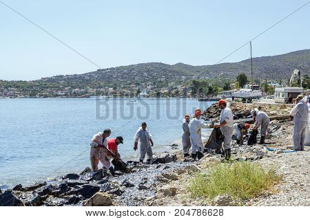Greece. The Island Of Salamis .10 September 2017. Workers remove oil that spilled from the tanker Agia Zoni sunk in the Saronic Gulf. Environmental disaster off the coast of the island of Salamis.