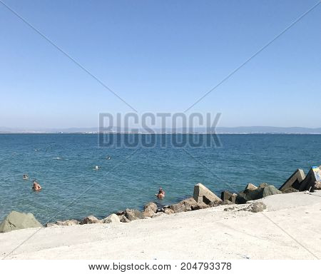 Pomorie Bulgaria - September 18 2017: People Enjoying Their Time At Pomorie Beach Bulgaria.