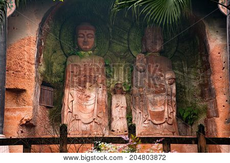 The Buddha statue in Leshan, China. The image of two women in a rock in full growth
