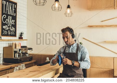 Worker Cleaning Glassware