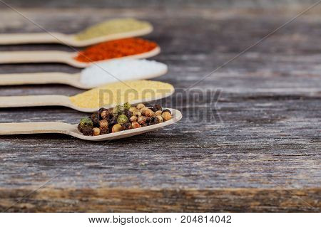 Different Spices In Bowls On Table