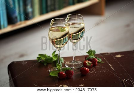 Wineglasses With White Wine Decorated With Strawberry And Mint