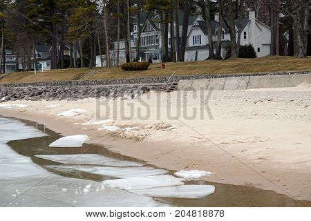 Ice along the beach in Wequetonsing, Michigan, begins to melt and break apart during March.