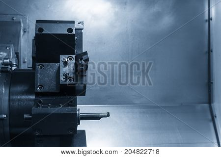CNC lathe cutting tool in the blue scene .Hi-precision CNC machining concept.