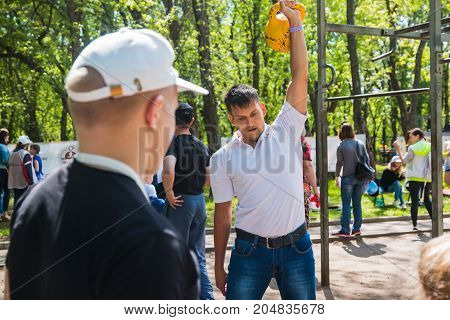 The Athlete Does Exercises During A Public Open Competition For Doing Standards Trp In Kirov City In