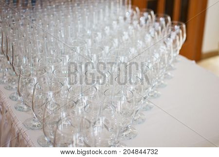Wineglasses before fourchette clear and crystal. Selective focus