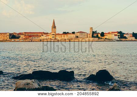 Sunset On The Seashore. City View Walk Along The Seafront