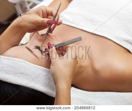 Eyelash Removal Procedure Close Up. Beautiful Woman With Long Lashes In A Beauty Salon. Eyelash Exte