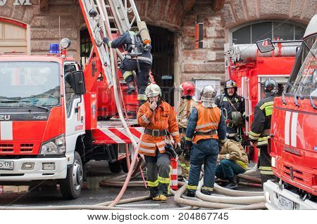 Saint Petersburg, Russia, on the morning of September 13, 2017. Firefighters extinguish a large fire on the roof of a residential house on the street Tchaikovsky 31.