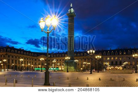 Vendome column with statue of Napoleon Bonaparte, on the Place Vendome at night, in France. Vendome column has 425 spiraling bas-relief bronze plates were made out of cannon.