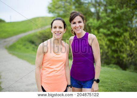 Two Beautiful Female runner outside having fun