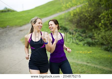 Two Beautiful Female runner outside having fun