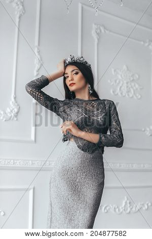 Portrait of beautiful woman with makeup in fashion clothes