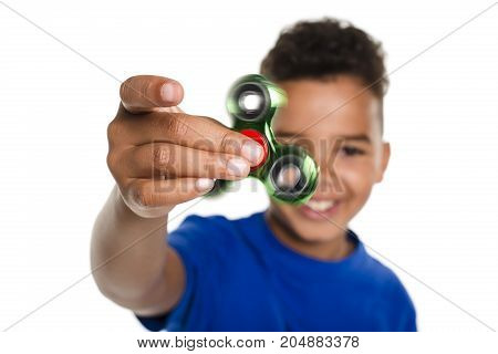A Boy Fidget Spinner Held in Foreground