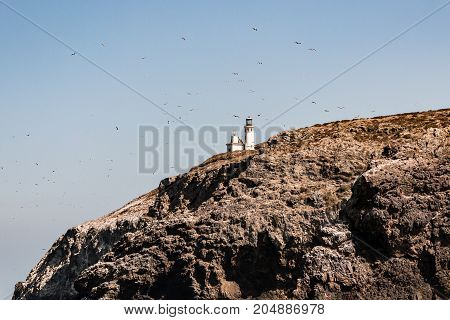 Anacapa Island, one of five volcanic islands off the coast of Port Hueneme, California, in Ventura County, the Anacapa lighthouse sitting high atop.