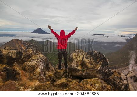 Freedom man standing on top of Mount Sibayak, Indonesia