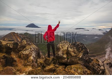 Freedom man standing on top of Mount Sibayak, Indonesia