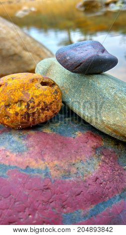It is natural photo of river stone of different colours.
