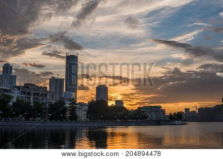 Yekaterinburg City Center On Sunset. City Pond View, Amazing Clouds And Sky. High Buildings, Skyscra