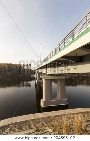 New Bridge Across The River, Made Of Concrete And Metal. The Photo Was Taken Close-up With The Botto
