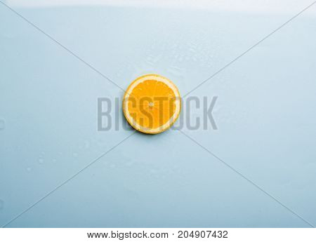 A yellow slice of ripe lemon. The concept of a healthy lifestyle.
