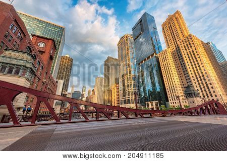 Chicago downtown and Chicago River with bridges during morning.