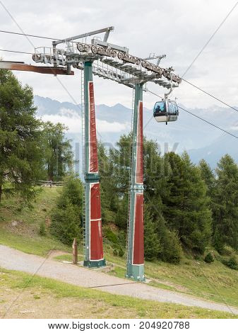 Ski Lift Chair In The Alps - Unrecognisable People In It