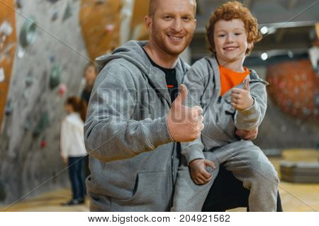 Dad With Son Showing Thumbs Up