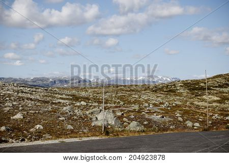 Road Through The Stone Tundra With Landmarks