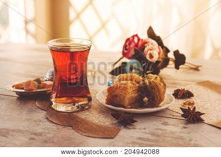 Traditional Glass Of Turkish Tea With Baklava