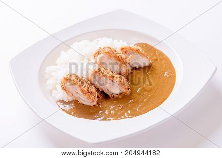 Curry rice with fried chicken on plate