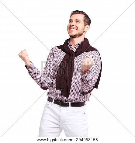 Excited handsome man with arms raised in success - Isolated on white