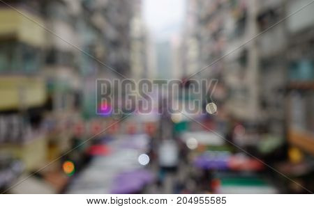People rush on a busy street of Hong Kong. Blurred scenery for background abstract.