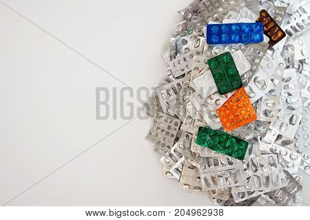 Heap Of Empty Assorted Various Medicine Tablets Pills Blisters Different Colors On White Background.