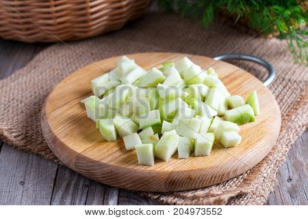 Sliced green Apple on a wooden board on a wooden table