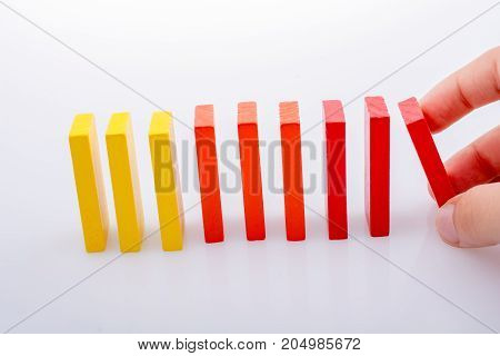 Hand Holding Color Dominoes