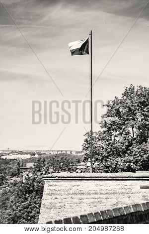Czech flag on the Spilberk castle Brno southern Moravia Czech republic. State symbol. Black and white photo.