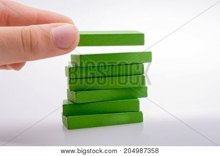 Hand Holding Color Dominoes