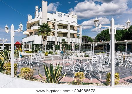 ALBANIA GOLEM- September 21 2015: Summer cafe near the hotel on the Adriatic coast. A blue sky with clouds a bright clear day