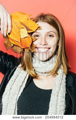 Girl With Orange Leaves On Orange Background.