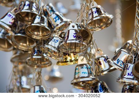 Muang, Phrae, Thailand - February 9, 2019: Many Silver Small Bells Hanging In The Temple To Pray For