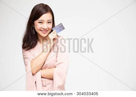 Happy Asian Woman Holding Credit Card Or Cash Advances, Pay Instead Of Money And Specially Curated B