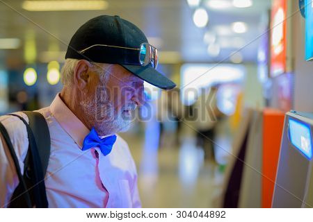 Handsome Senior Tourist Man Exploring The City Of Bangkok, Thail