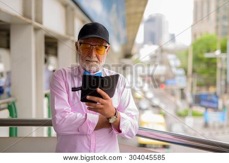 Handsome Senior Tourist Man Exploring The City Of Bangkok, Thail