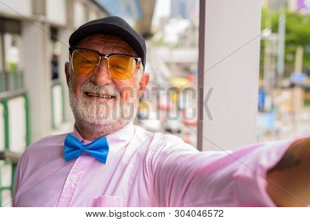 Handsome Senior Tourist Man Exploring The City Of Bangkok, Thail