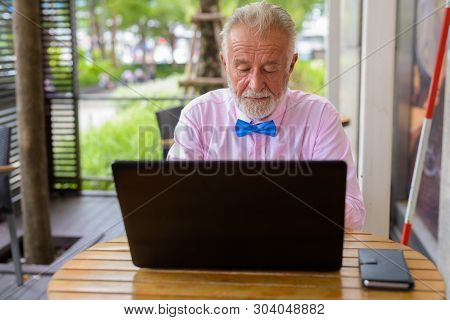 Handsome Senior Tourist Man Exploring The City Of Bangkok, Thail