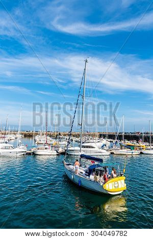 Morgat, France - August 4, 2018:  A Yacht In The Marina Of Morgat A Sunny Day Of Summer With Many Sm