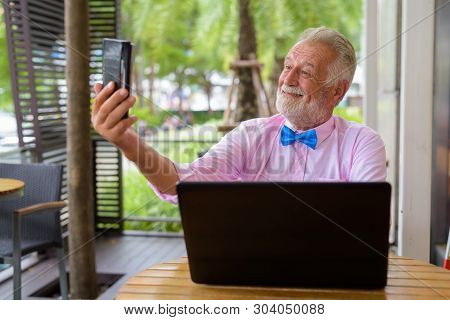 Handsome Senior Tourist Man Exploring The City Of Bangkok, Thail