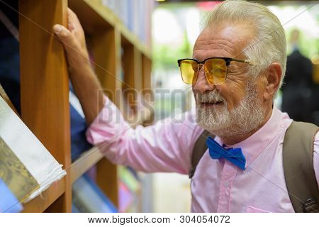 Handsome Senior Tourist Man Exploring The City Of Bangkok, Thail